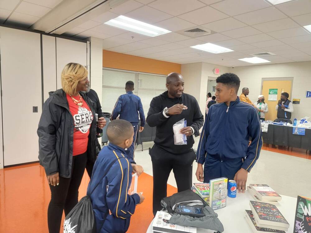 Dexter Williams speaking to youth attendees during the college fair at the tournament