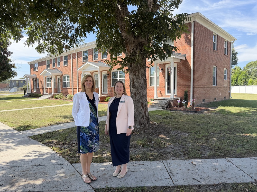 Janneke Ratcliffe and Michele Wiggins standing in front of Park Court