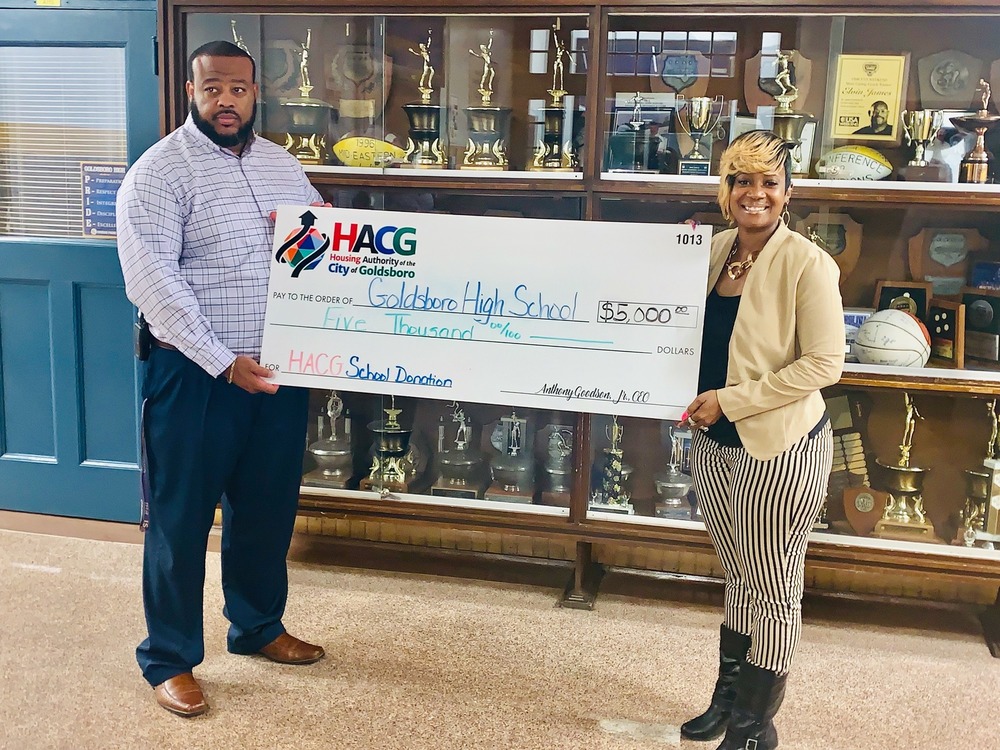 HACG with Goldsboro High School principal presenting donation