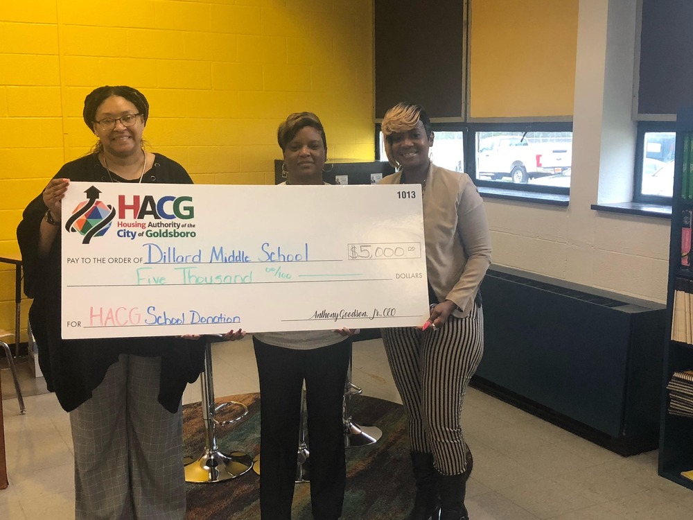 HACG Staff with Dillard Middle School staff presenting donation check