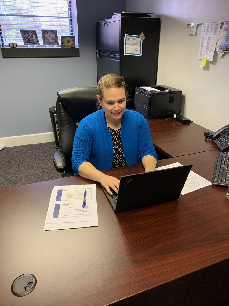 Michele Wiggins working on a computer