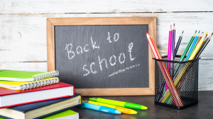 Back to school banner with chalk board and pencils on table