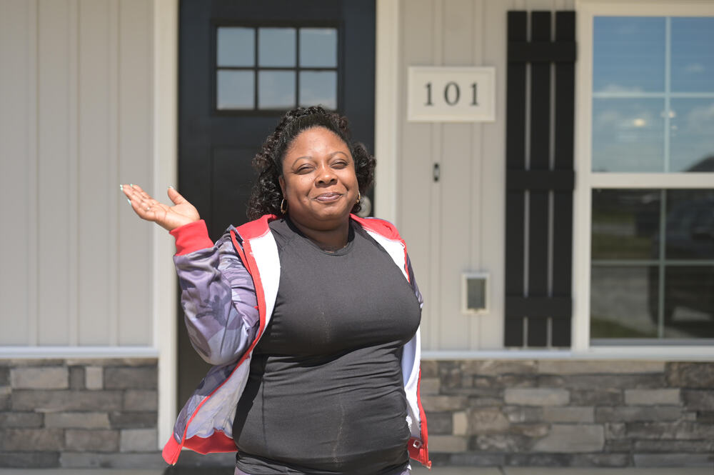 Ashley Hinton outside her new home