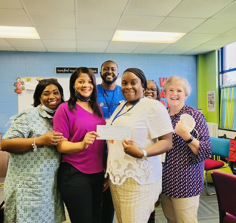 HACG Jobs Plus Staff with CSS Gail Lewis Group with check donation