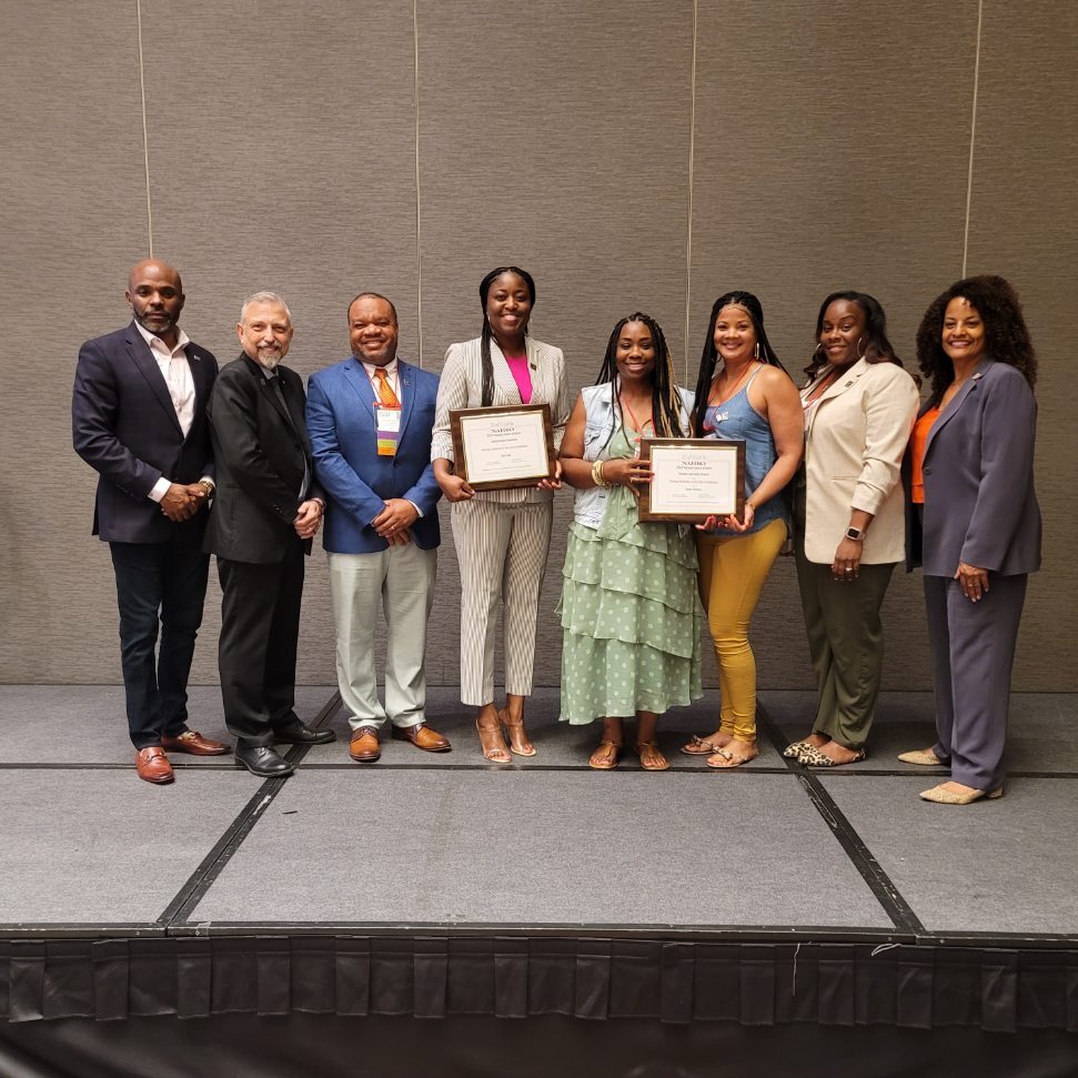 NAHRO Officials and HACG Staff are posed with Award of Merit Certificates in hand